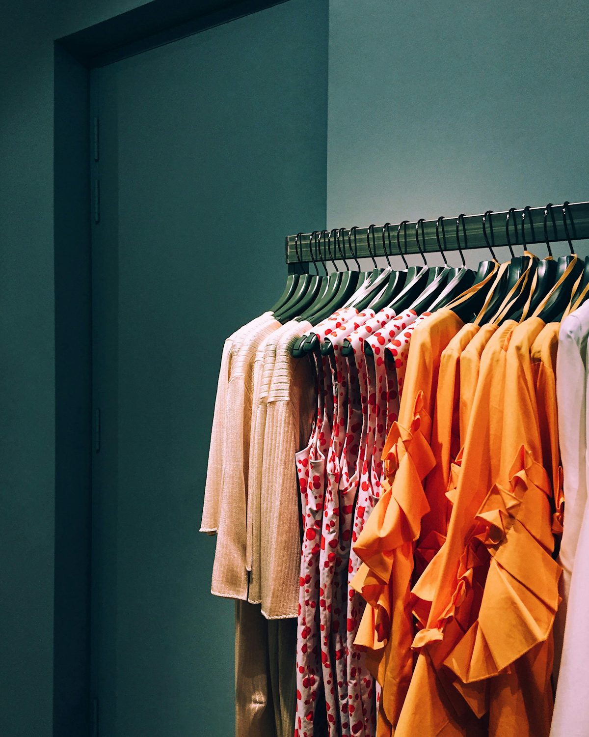 Assorted shirts hanging on a rack